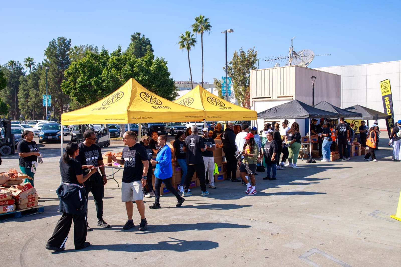 Volunteers sorting and distributing donated goods